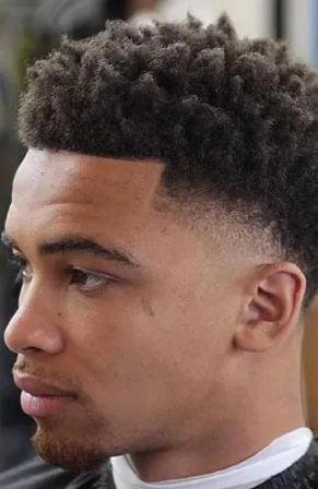 Taper-Fade-Afro-with-a-Twist-Haircuts